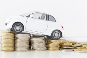 MSP parking rates feature image of a car on coins.